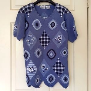 Women short sleeve knit sweater with embroidery and design.